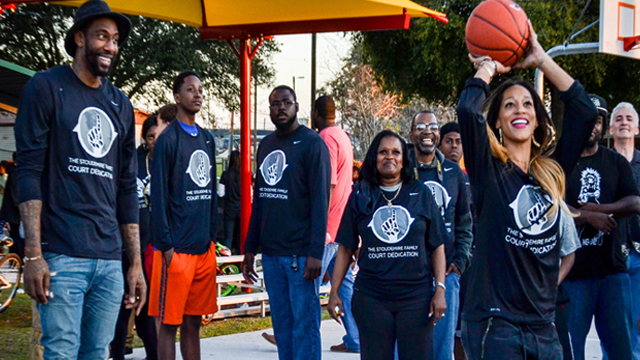 Alexis practices her jumpshot as Amar'e looks on.  Photo: Mike Reynolds 